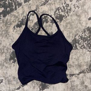 Kyodan women’s workout top with built in bra and removable pads.